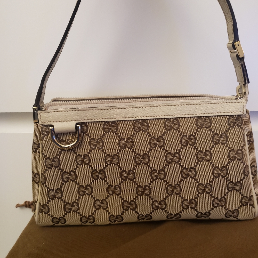 Authentic Gucci beige monogram pouchette